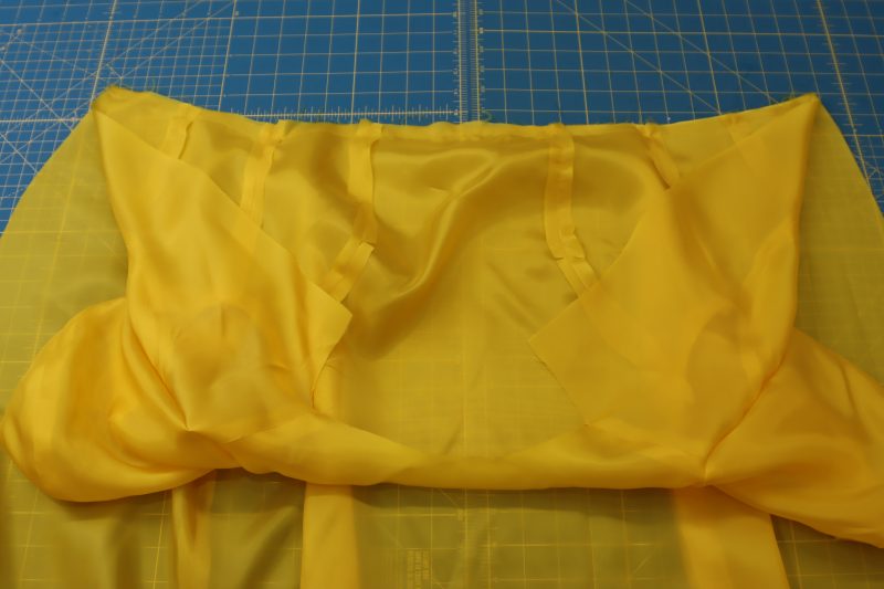 How To Pin Sew Lining Top Skirt Waistlines - Bemberg Lining - Mood Fabrics - Silverstone Mini Dress Free Sewing Pattern Tutorial - MDF489 - Mood Fabrics Sewciety Blog - Pin and sew the lining skirt waistline to the lining top waistline.