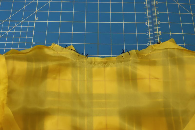 How To Cut Notches Into Neckline - Virgin Wool Twill - Mood Fabrics - Silverstone Mini Dress Free Sewing Pattern Tutorial - MDF489 - Mood Fabrics Sewciety Blog - Cut notches into the rounded part of the neckline.