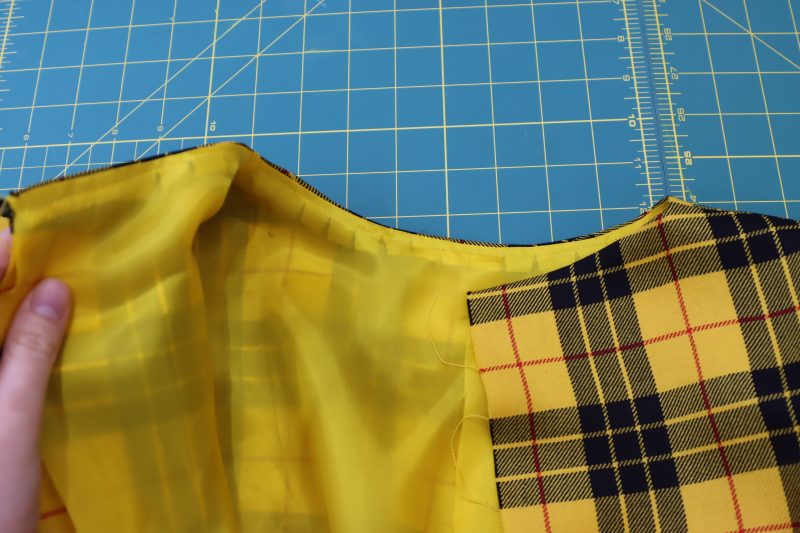 How To Iron Neckline - Bemberg Lining - Mood Fabrics - Silverstone Mini Dress Free Sewing Pattern Tutorial - MDF489 - Mood Fabrics Sewciety Blog - Iron the neckline so that the lining is hidden behind the main fabric.