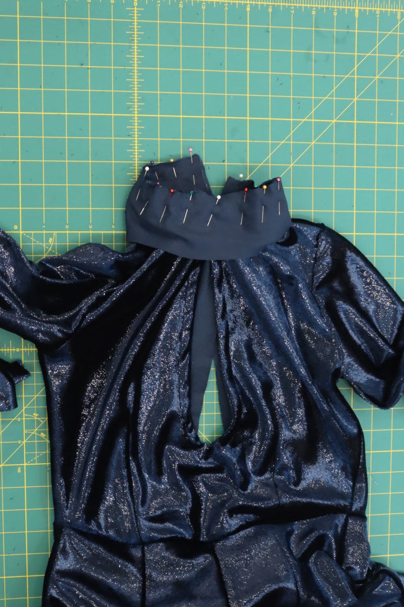 How To Sandwich Collar Around Neckline - Metallic Velvet - Mood Fabrics - Jasper Jumpsuit Free Sewing Pattern Tutorial - MDF486 - Mood Fabrics Sewciety Blog - Sandwich the collar pieces around the neckline, then pin.