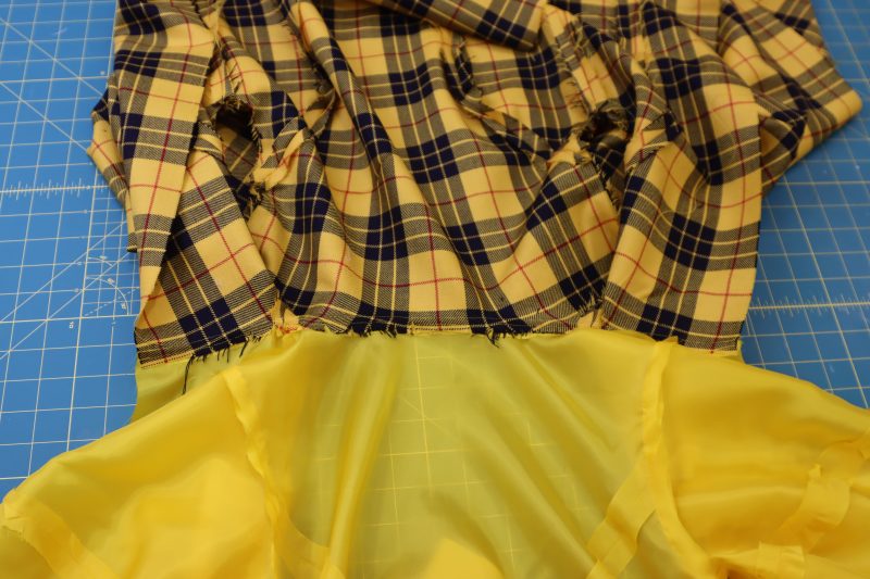 How To Understitch Seam Allowance To Lining - Bemberg Lining - Mood Fabrics - Silverstone Mini Dress Free Sewing Pattern Tutorial - MDF489 - Mood Fabrics Sewciety Blog - Understitch the seam allowance to the lining at the neckline.