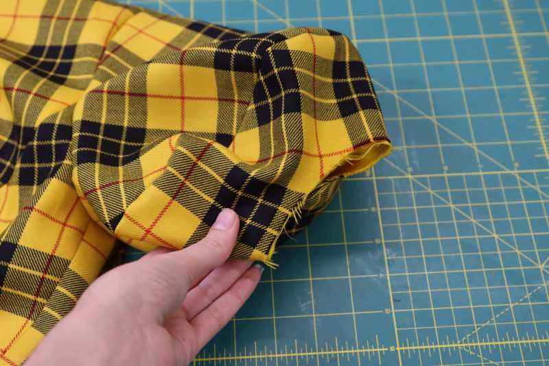 How To Stay Stitch Sleeve Opening - Virgin Wool Twill - Mood Fabrics - Silverstone Mini Dress Free Sewing Pattern Tutorial - MDF489 - Mood Fabrics Sewciety Blog - Stay stitch the lining sleeve to the main sleeve with ¼ inch seam allowance.
