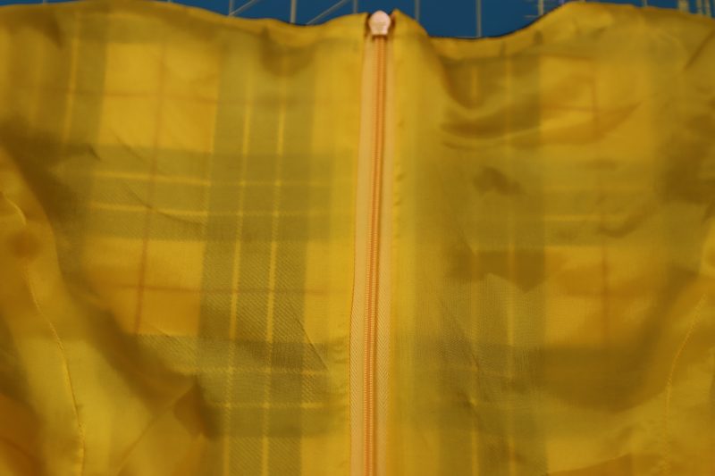 How To Finish Center Back Lining - Bemberg Lining - Mood Fabrics - Silverstone Mini Dress Free Sewing Pattern Tutorial - MDF489 - Mood Fabrics Sewciety Blog - Lining fabric is finished at the center back zipper.