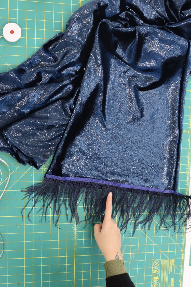 How To Sew Frings To Hems - Ostrich Feather Fringe - Mood Fabrics - Jasper Jumpsuit Free Sewing Pattern Tutorial - MDF486 - Mood Fabrics Sewciety Blog - Sew the fringe to the pant and sleeve hems so that the fringe tape is on the inside of the fabric and only the feathers are sticking out.