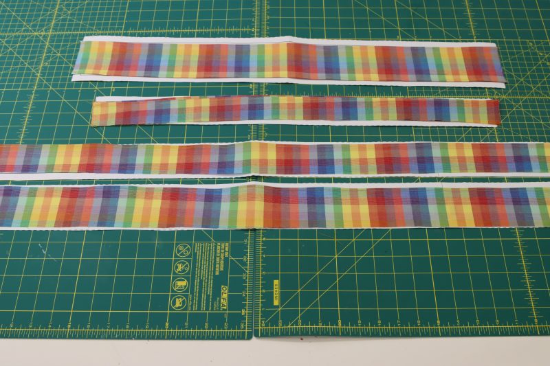 How To Hem All Ruffle Pieces - Rainbow Checks Cotton Shirting - Mood Fabrics - Bayport Blouse Free Sewing Pattern Tutorial - MDF494 - Mood Fabrics Sewciety Blog - Repeat for the collar ruffles, sleeve ruffles, and front center ruffle.