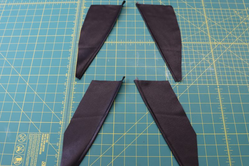 How To Hem Pocket Facings - Buttery Faux Leather - Mood Fabrics - Dresden Shorts Free Sewing Pattern Tutorial - MDF493 - Mood Fabrics Sewciety Blog - Hem inner diagonal edge of pocket facings.