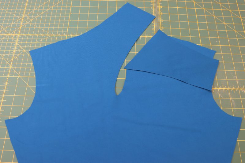 How To Layout Front Neckline Extension - Stretch Ponte Knit - Mood Fabrics - Topeka Keyhole Dress Free Sewing Pattern Tutorial - MDF496 - Mood Fabrics Sewciety Blog - Layout front neckline extension piece.