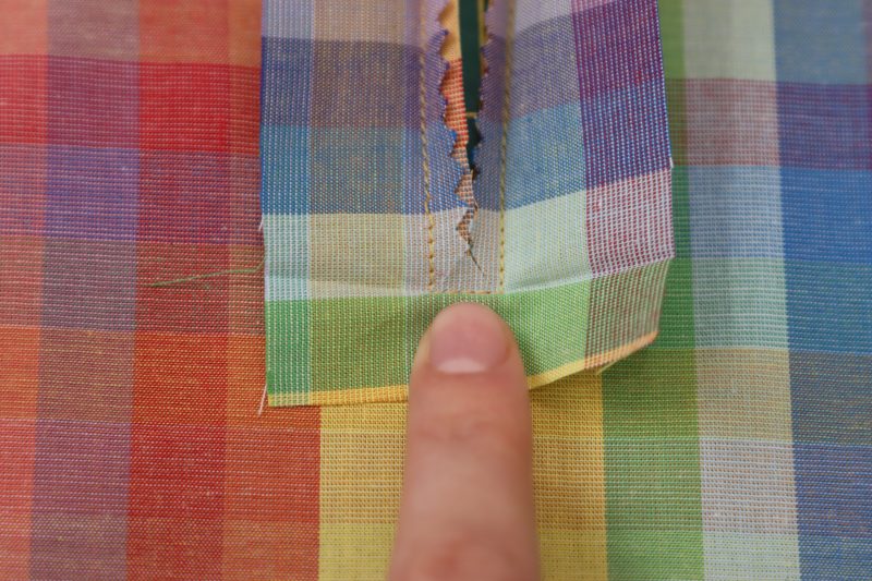 How To Clip Keyhole Corners - Rainbow Checks Cotton Shirting - Mood Fabrics - Bayport Blouse Free Sewing Pattern Tutorial - MDF494 - Mood Fabrics Sewciety Blog - Snip the corners of the keyhole before turning it right sides out.