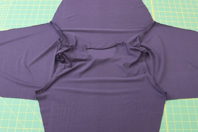 How To Sew Both Sleeves - Stretch Bamboo Jersey - Mood Fabrics - Altena Blouse Free Sewing Pattern Tutorial - MDF491 - Mood Fabrics Sewciety Blog - Sew both sleeve caps to their respective armscyes.