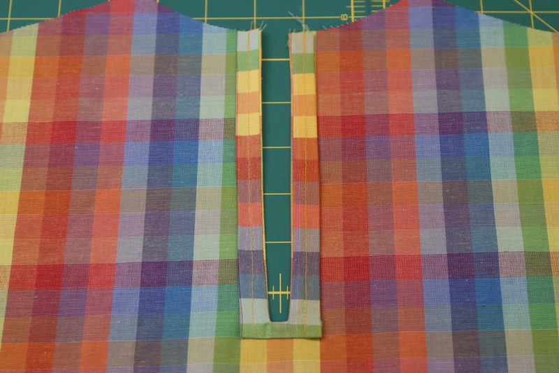 How To Topstitch Keyhole Facing Raw Edges - Gutermann Sew All Thread - Mood Fabrics - Bayport Blouse Free Sewing Pattern Tutorial - MDF494 - Mood Fabrics Sewciety Blog - Topstitch the keyhole facing to the keyhole.