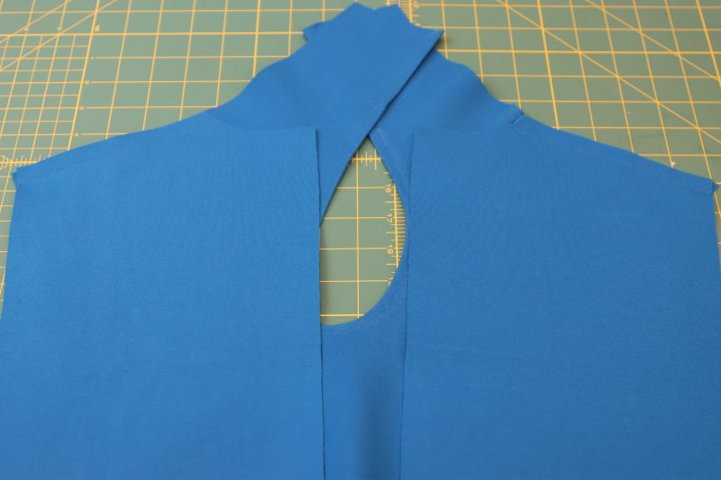 How To Pin Sew Back Pieces On Front Piece At Shoulders - Stretch Ponte Knit - Mood Fabrics - Topeka Keyhole Dress Free Sewing Pattern Tutorial - MDF496 - Mood Fabrics Sewciety Blog - Pin and sew the shoulder seams.