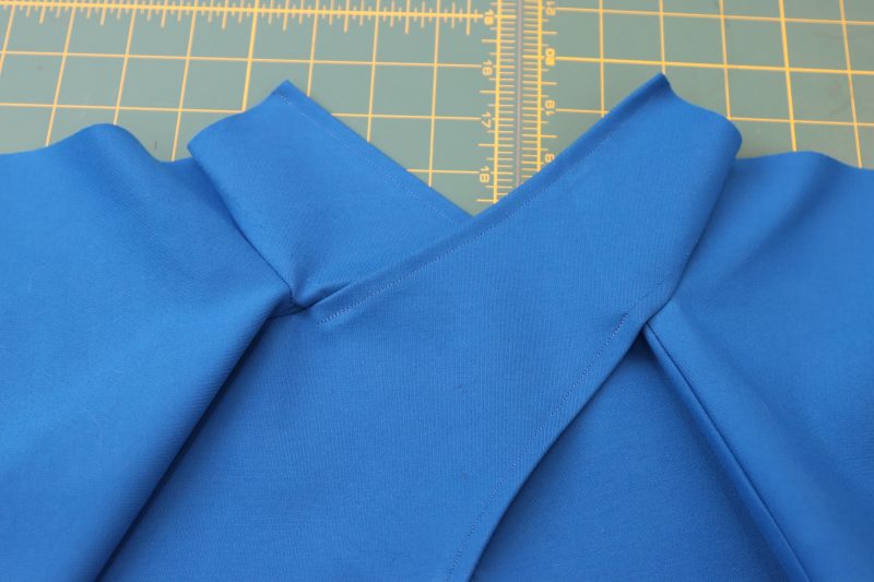 How To Hem Collar Raw Edges - Stretch Ponte Knit - Mood Fabrics - Topeka Keyhole Dress Free Sewing Pattern Tutorial - MDF496 - Mood Fabrics Sewciety Blog - Hem the tops of the collar.