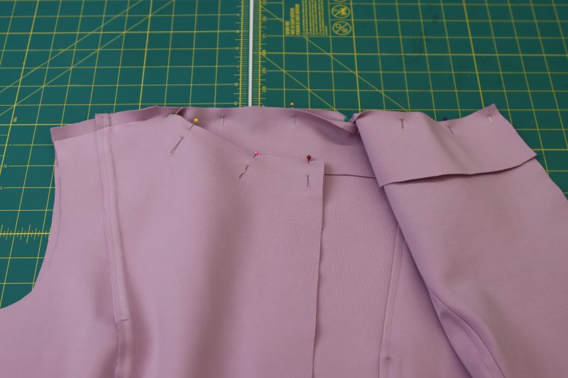 How To Pin Sew Neckline Facing - Stretch Ponte Knit - Mood Fabrics - Camarillo Cardigan and Magdalene Midi Skirt Free Sewing Pattern Tutorial - MDF490 - Mood Fabrics Sewciety Blog - Pin and sew the neckline facing to the neckline.