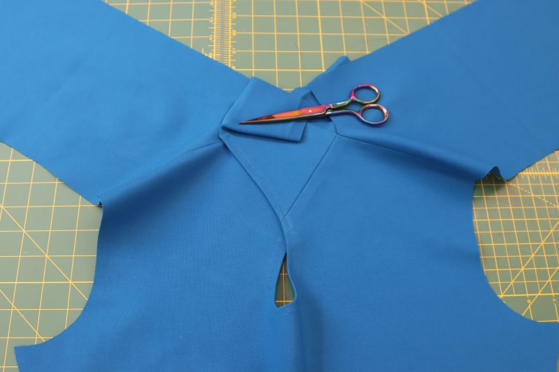 How To - - Mood Fabrics - Topeka Keyhole Dress Free Sewing Pattern Tutorial - MDF496 - Mood Fabrics Sewciety Blog - Sew the front neck extension to the back left neckline.