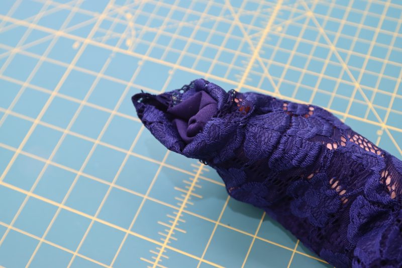 How To Pinch Sleeve Ends - Stretch Crochet Lace - Mood Fabrics - Altena Blouse Free Sewing Pattern Tutorial - MDF491 - Mood Fabrics Sewciety Blog - Grab the ends of the sleeves in between the two layers of the top.