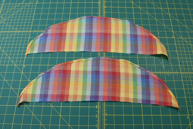 How To Sew Baby Hem On Shoulder Ruffles - Rainbow Checks Cotton Shirting - Mood Fabrics - Bayport Blouse Free Sewing Pattern Tutorial - MDF494 - Mood Fabrics Sewciety Blog - Sew a baby hem along the rounded edges of the shoulder ruffles.
