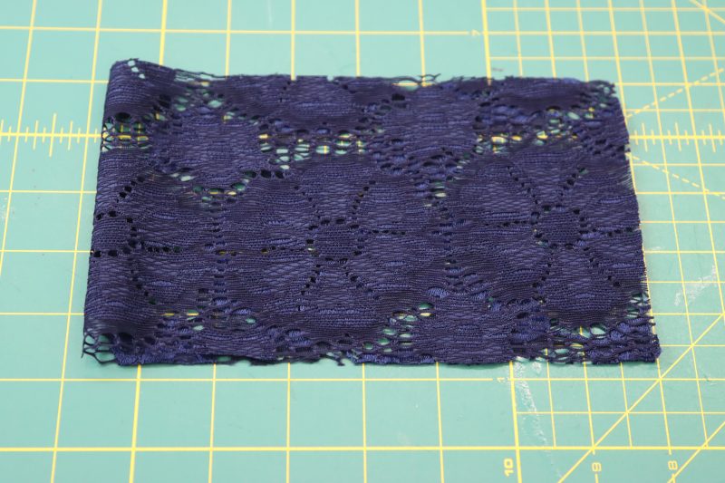 How To Fold Collar Right Sides Together - Stretch Crochet Lace - Mood Fabrics - Altena Blouse Free Sewing Pattern Tutorial - MDF491 - Mood Fabrics Sewciety Blog - Fold the collar right sides together.