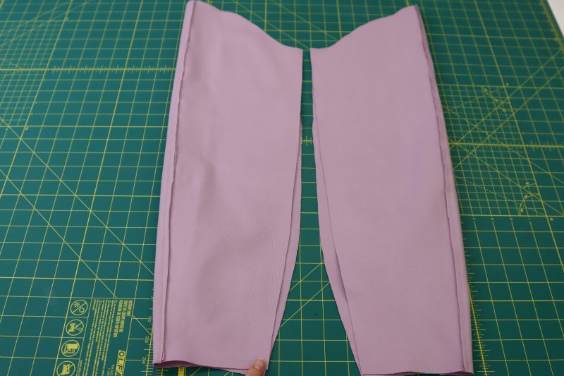 How To Fold Sleeves Right Sides Together - Stretch Ponte Knit - Mood Fabrics - Camarillo Cardigan and Magdalene Midi Skirt Free Sewing Pattern Tutorial - MDF490 - Mood Fabrics Sewciety Blog - Fold the sleeves in half and sew the sleeve inseam.