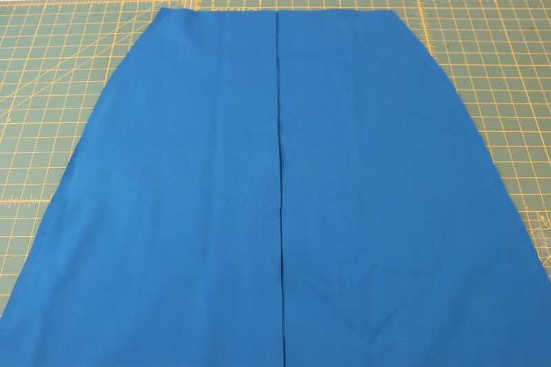 How To Pin Sew Front Back Skirt Pieces At Side Seams - Stretch Ponte Knit - Mood Fabrics - Topeka Keyhole Dress Free Sewing Pattern Tutorial - MDF496 - Mood Fabrics Sewciety Blog - Pin and sew the skirt side seams.