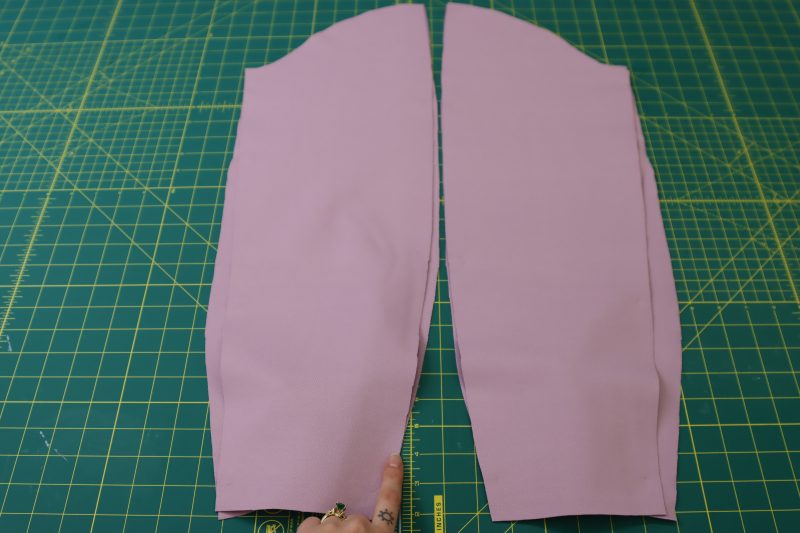 How To Place Sleeve Pieces Right Sides Together - Stretch Ponte Knit - Mood Fabrics - Camarillo Cardigan and Magdalene Midi Skirt Free Sewing Pattern Tutorial - MDF490 - Mood Fabrics Sewciety Blog - Place the two sleeve pieces right sides together with the side seams lined up.