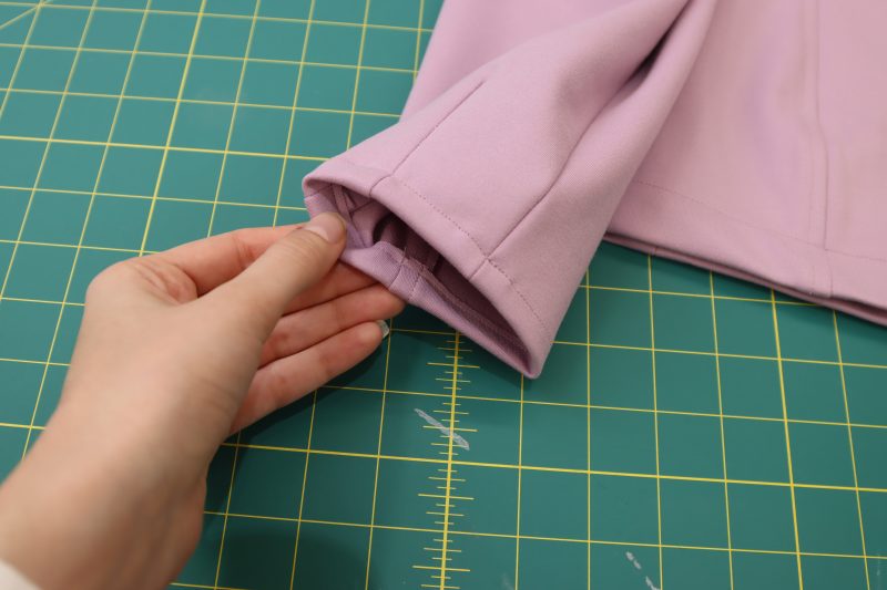 How To Hem Sleeves - Stretch Ponte Knit - Mood Fabrics - Camarillo Cardigan and Magdalene Midi Skirt Free Sewing Pattern Tutorial - MDF490 - Mood Fabrics Sewciety Blog - Hem the ends of the sleeves.