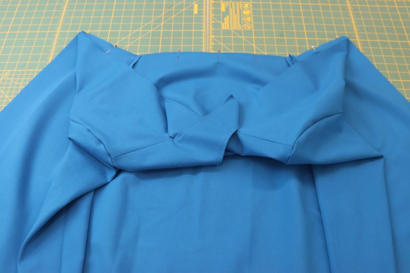 How To Pin Sew Top To Skirt At Waistline - Stretch Ponte Knit - Mood Fabrics - Topeka Keyhole Dress Free Sewing Pattern Tutorial - MDF496 - Mood Fabrics Sewciety Blog - Pin and sew the top to the skirt.