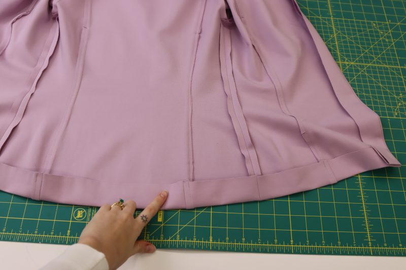 How To Fold Cardigan Hem - Stretch Ponte Knit - Mood Fabrics - Camarillo Cardigan and Magdalene Midi Skirt Free Sewing Pattern Tutorial - MDF490 - Mood Fabrics Sewciety Blog - Fold and iron the bottom hem to your desired length.
