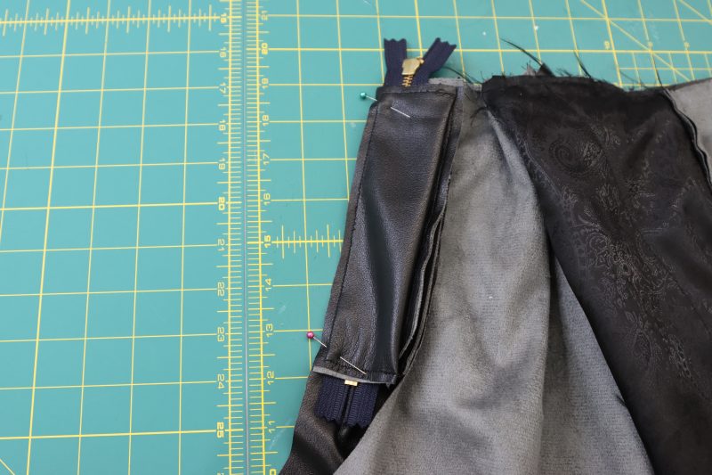 How To Pin Fly Shield - Buttery Faux Leather - Mood Fabrics - Dresden Shorts Free Sewing Pattern Tutorial - MDF493 - Mood Fabrics Sewciety Blog - Pin the fly shield directly on top of the zipper seam.