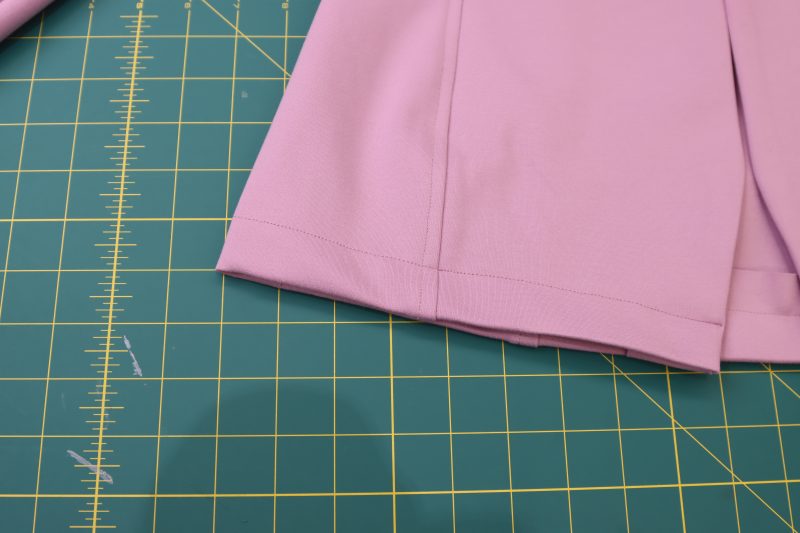 How To Sew Cardigan Hem - Stretch Ponte Knit - Mood Fabrics - Camarillo Cardigan and Magdalene Midi Skirt Free Sewing Pattern Tutorial - MDF490 - Mood Fabrics Sewciety Blog - Sew the bottom of the cardigan with 1 inch seam allowance.