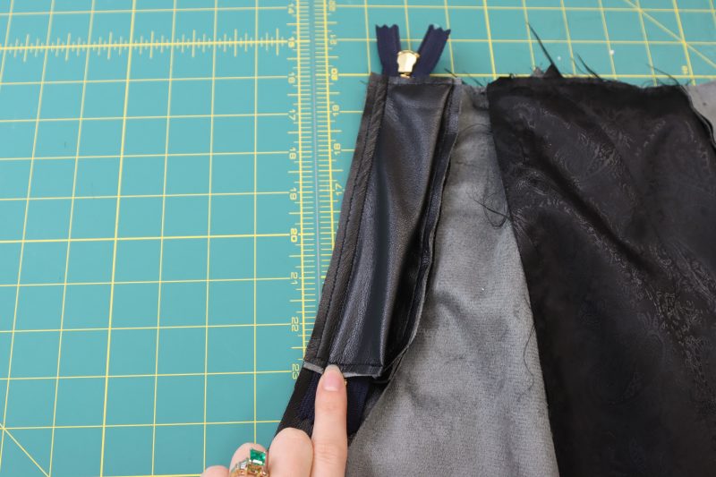 How To Sew Fly Shield - Buttery Faux Leather - Mood Fabrics - Dresden Shorts Free Sewing Pattern Tutorial - MDF493 - Mood Fabrics Sewciety Blog - Sew the fly shield on top of the zipper, following the zipper seam.