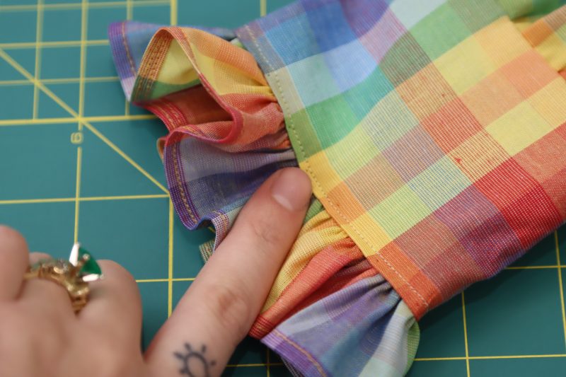 How To Topstitch Sleeve Ruffles To Cuffs - Rainbow Checks Cotton Shirting - Mood Fabrics - Bayport Blouse Free Sewing Pattern Tutorial - MDF494 - Mood Fabrics Sewciety Blog - Topstitch the sleeve ruffles into the cuffs.