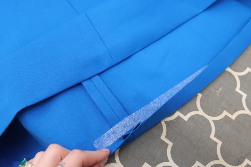 How To Iron Hem Tape Into Hems - Stretch Ponte Knit - Mood Fabrics - Topeka Keyhole Dress Free Sewing Pattern Tutorial - MDF496 - Mood Fabrics Sewciety Blog - Iron hem tape into the hem and sleeve openings.