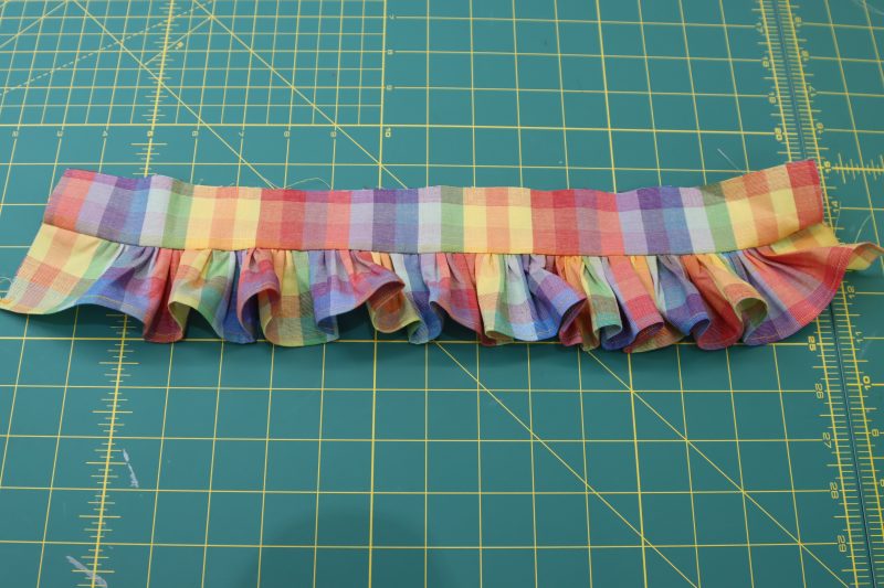 How To Sew Bottom Ruffle Between Collars - Rainbow Checks Cotton Shirting - Mood Fabrics - Bayport Blouse Free Sewing Pattern Tutorial - MDF494 - Mood Fabrics Sewciety Blog - Sew the bottom ruffle in between the collar pieces.