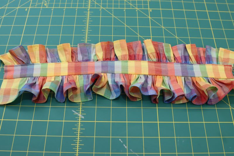 How To Topstitch Top Ruffle Between Collar Pieces - Rainbow Checks Cotton Shirting - Mood Fabrics - Bayport Blouse Free Sewing Pattern Tutorial - MDF494 - Mood Fabrics Sewciety Blog - Topstitch the top collar ruffle into place.