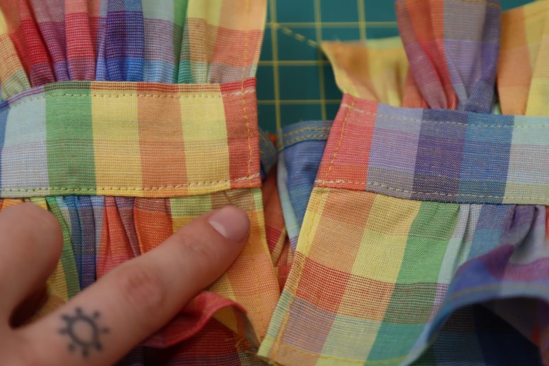 How To Hem Collar Raw Edges - Rainbow Checks Cotton Shirting - Mood Fabrics - Bayport Blouse Free Sewing Pattern Tutorial - MDF494 - Mood Fabrics Sewciety Blog - Hem the raw edges of the center back of the collar and ruffles.