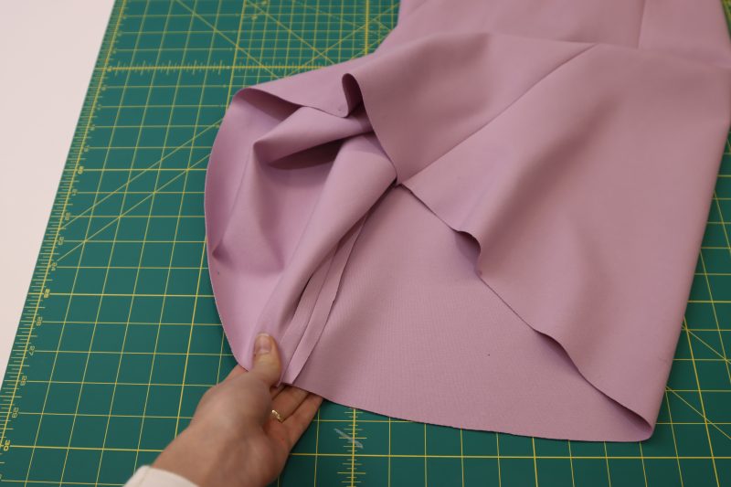 How To Press Skirt Side Seams - Stretch Ponte Knit - Mood Fabrics - Camarillo Cardigan and Magdalene Midi Skirt Free Sewing Pattern Tutorial - MDF490 - Mood Fabrics Sewciety Blog - Press the side seams open and flat.
