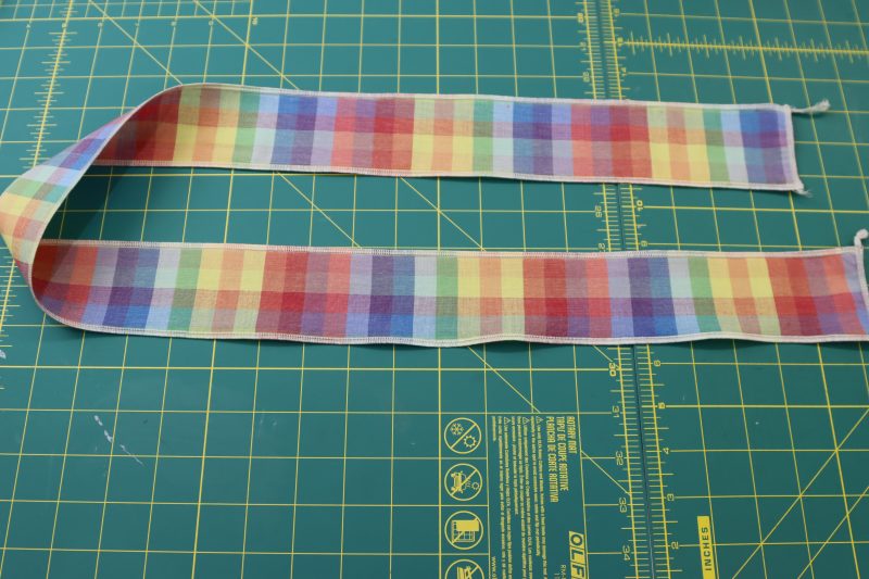 How To Cut Elastic Casing - Rainbow Checks Cotton Shirting - Mood Fabrics - Bayport Blouse Free Sewing Pattern Tutorial - MDF494 - Mood Fabrics Sewciety Blog - Cut a strip of fabric for the elastic casing.
