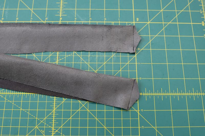 How To Sew Short Ends Of Waistband - Buttery Faux Leather - Mood Fabrics - Dresden Shorts Free Sewing Pattern Tutorial - MDF493 - Mood Fabrics Sewciety Blog - Sew the short ends of the waistband right sides together.