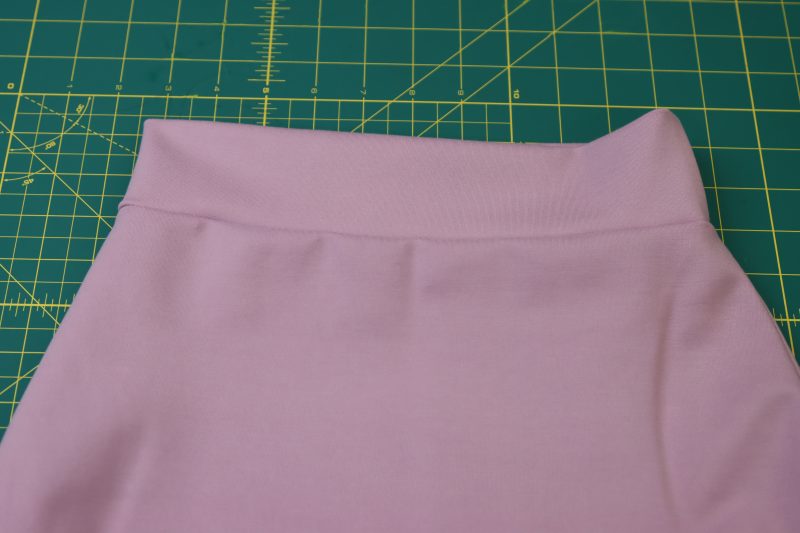 How To Flip Wasitband Up - Stretch Ponte Knit - Mood Fabrics - Camarillo Cardigan and Magdalene Midi Skirt Free Sewing Pattern Tutorial - MDF490 - Mood Fabrics Sewciety Blog - Fold waistband up to hide the seam allowance.