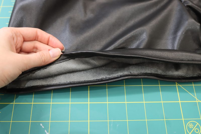 How To Sew Raw Edge To Fold - Buttery Faux Leather - Mood Fabrics - Dresden Shorts Free Sewing Pattern Tutorial - MDF493 - Mood Fabrics Sewciety Blog - Sew the raw edge to the fold.