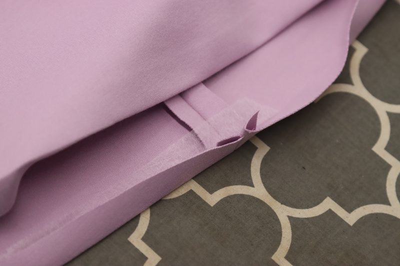 How To Place Hem Tape - Stretch Ponte Knit - Mood Fabrics - Camarillo Cardigan and Magdalene Midi Skirt Free Sewing Pattern Tutorial - MDF490 - Mood Fabrics Sewciety Blog - Place hem tape into fold.