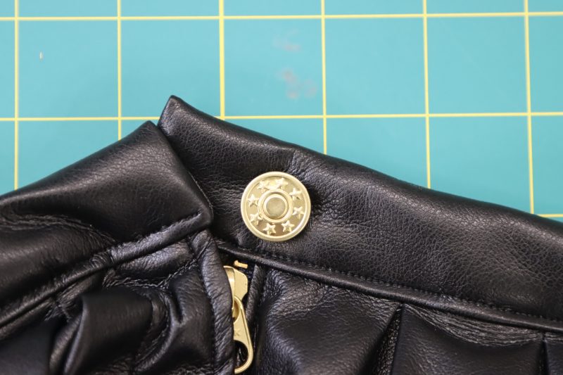 How To Secure Button Cap Onto Backing - Gold Jeans Buttons - Mood Fabrics - Dresden Shorts Free Sewing Pattern Tutorial - MDF493 - Mood Fabrics Sewciety Blog - Secure the jeans button cap to the backing with a hammer.