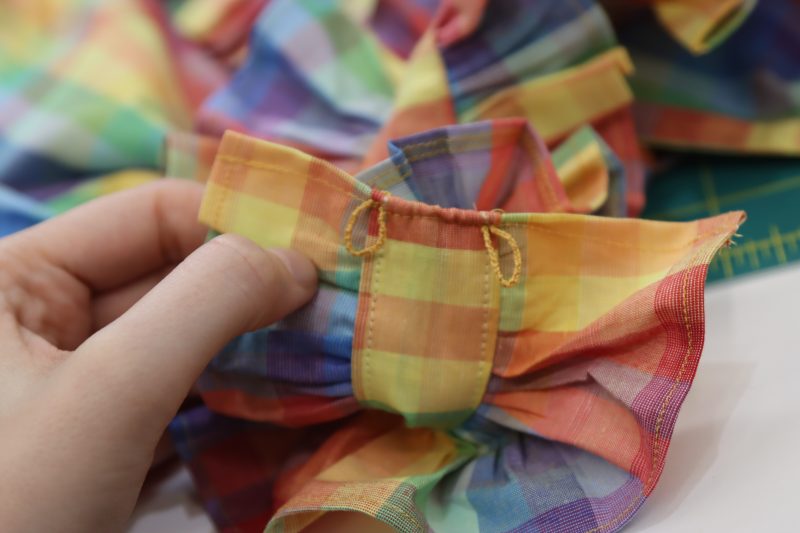 How To Tie Button Loops - Gutermann Sew All Thread - Mood Fabrics - Bayport Blouse Free Sewing Pattern Tutorial - MDF494 - Mood Fabrics Sewciety Blog - Repeat until you have two button loops.