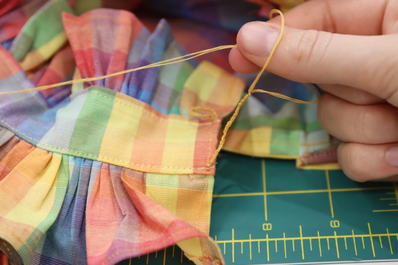 How To Tie Repeating Slip Knots - Gutermann Sew All Thread - Mood Fabrics - Bayport Blouse Free Sewing Pattern Tutorial - MDF494 - Mood Fabrics Sewciety Blog - Repeat the steps until you have a long chain of knots.