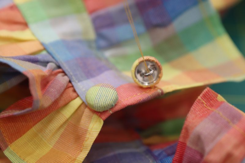 How To Sew Covered Buttons By Hand - Maxant Button Cover Kit - Mood Fabrics - Bayport Blouse Free Sewing Pattern Tutorial - MDF494 - Mood Fabrics Sewciety Blog - Hand sew the fabric covered buttons to the back neckline opening.