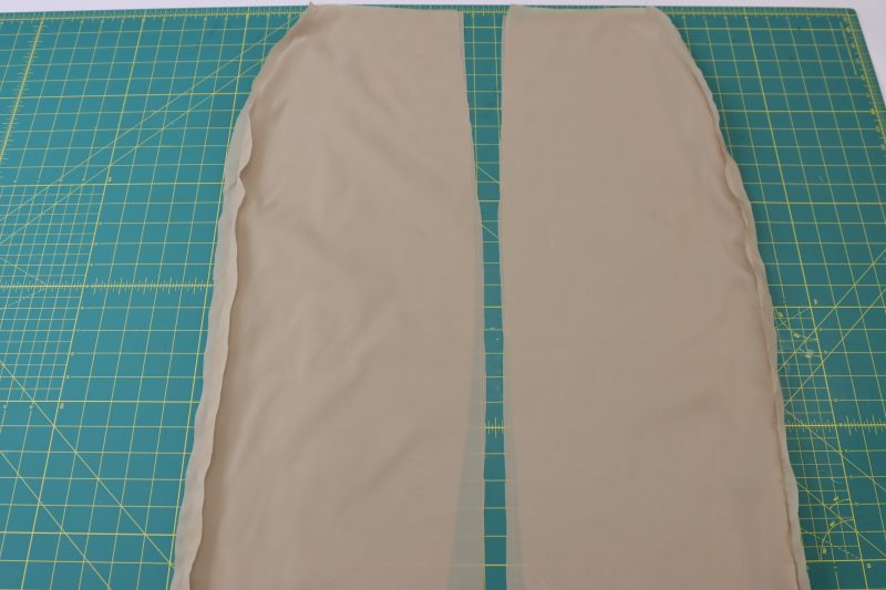 How To Pin Sew Lining Side Seams - Stretch Polyester Lining - Mood Fabrics - Peak Pencil Skirt Free Sewing Pattern Tutorial - MDF507 - Mood Fabrics Sewciety Blog - Pin and sew the lining side seams.