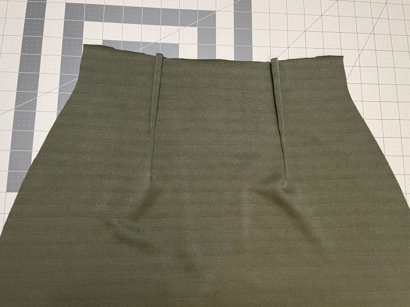 How To Press Darts - Stretch Liverpool Knit - Mood Fabrics - Marin Mini Skirt Free Sewing Pattern Tutorial - MDF499 - Mood Fabrics Sewciety Blog - Press the darts toward the side seams.