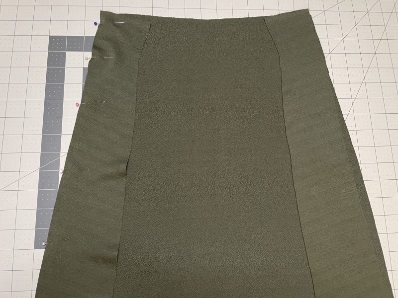 How To Pin Sew Front Side Panels - Stretch Liverpool Knit - Mood Fabrics - Marin Mini Skirt Free Sewing Pattern Tutorial - MDF499 - Mood Fabrics Sewciety Blog - Pin and sew the front side panels to the sides of the skirt front.