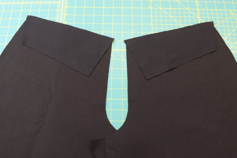 How To Pin Yokes - Cotton Canvas - Mood Fabrics - Clarkston Carpenter Pants Free Sewing Pattern Tutorial - MDF503 - Mood Fabrics Sewciety Blog - Pin the yokes to the back pants pieces, right sides together.