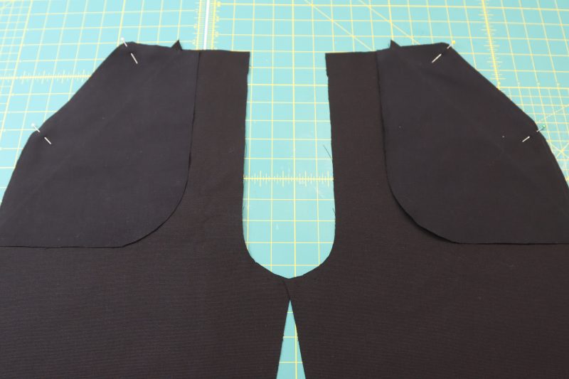 How To Pin Pocket A To Front Pants - Cotton Canvas - Mood Fabrics - Clarkston Carpenter Pants Free Sewing Pattern Tutorial - MDF503 - Mood Fabrics Sewciety Blog - Pin the A pockets to the front pants pieces.